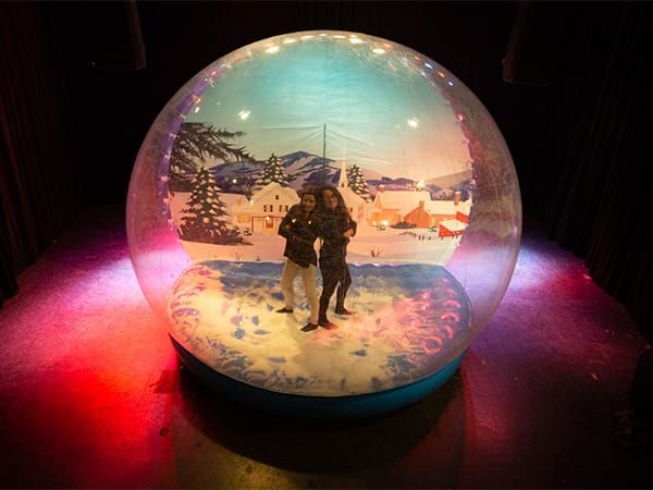 Human snow globe corporate event