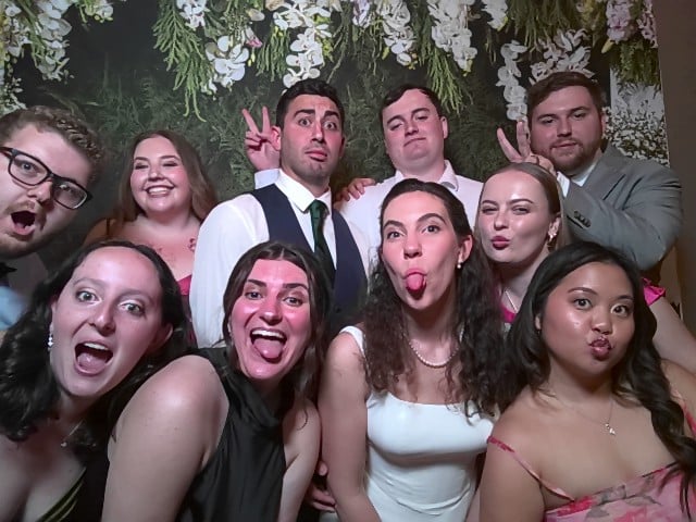 Guests using a Magic Mirror Photo Booth at a formal event