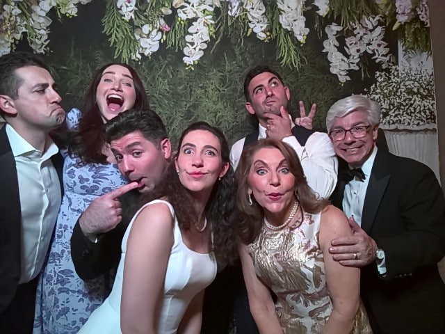 Bride and groom posing with family in a wedding photo booth in Philadelphia