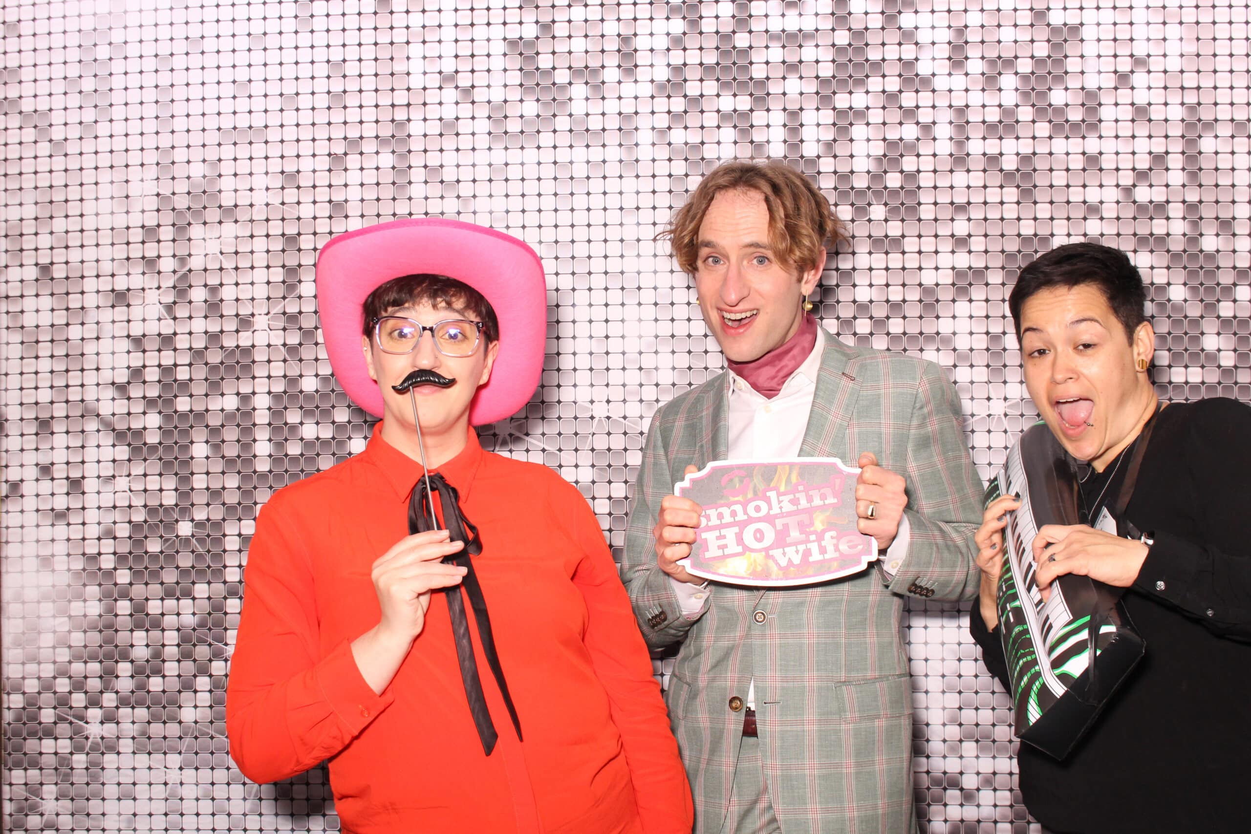 Family members posing together at a private party photo booth