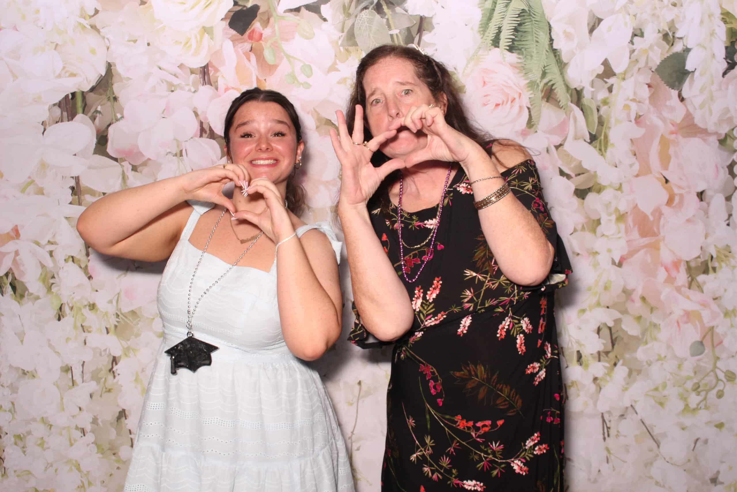 Bride and groom posing with family in a wedding photo booth in Philadelphia